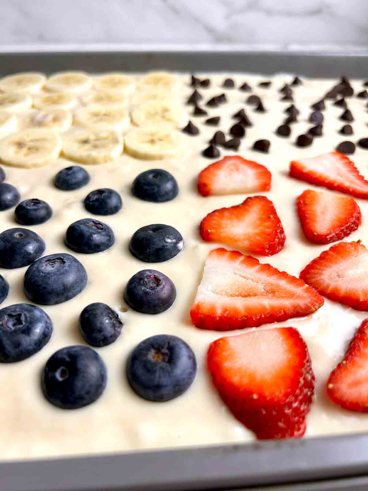 close up of batter with toppings.