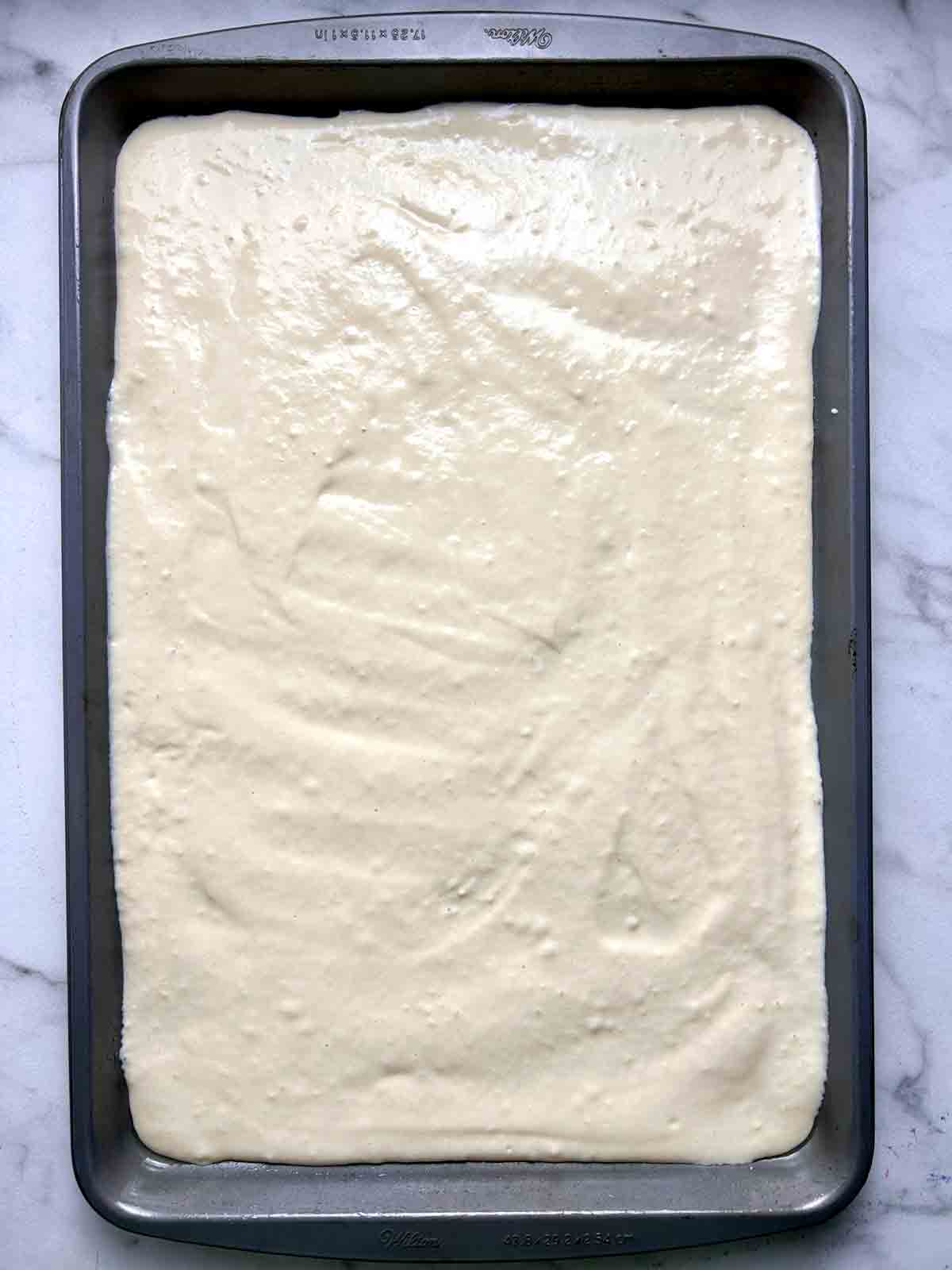 batter spread onto sheet pan.