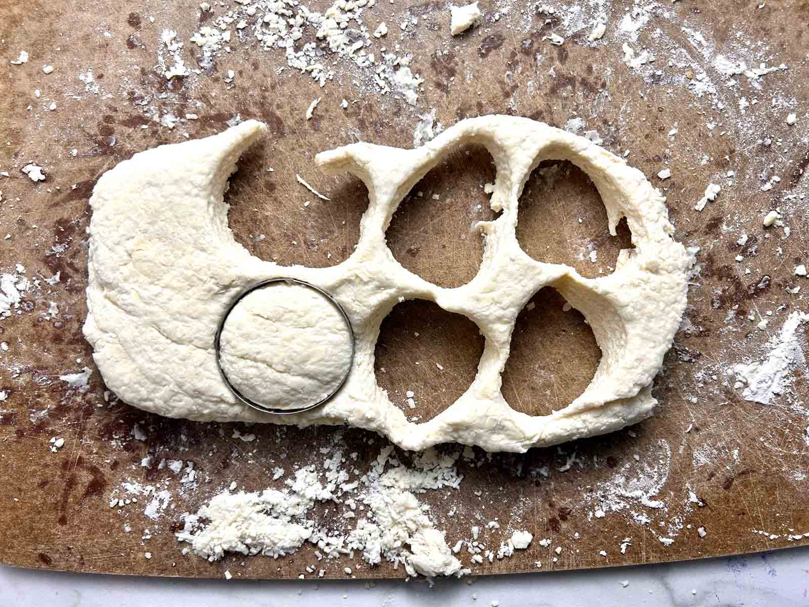 circles being cut out of dough.