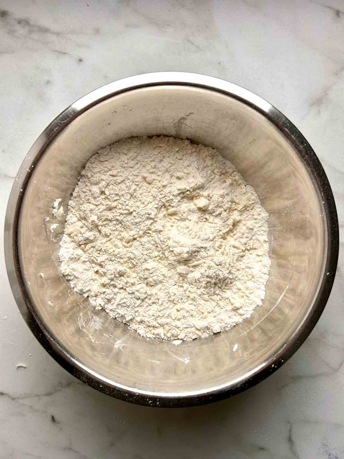 butter grated into flour mixture.