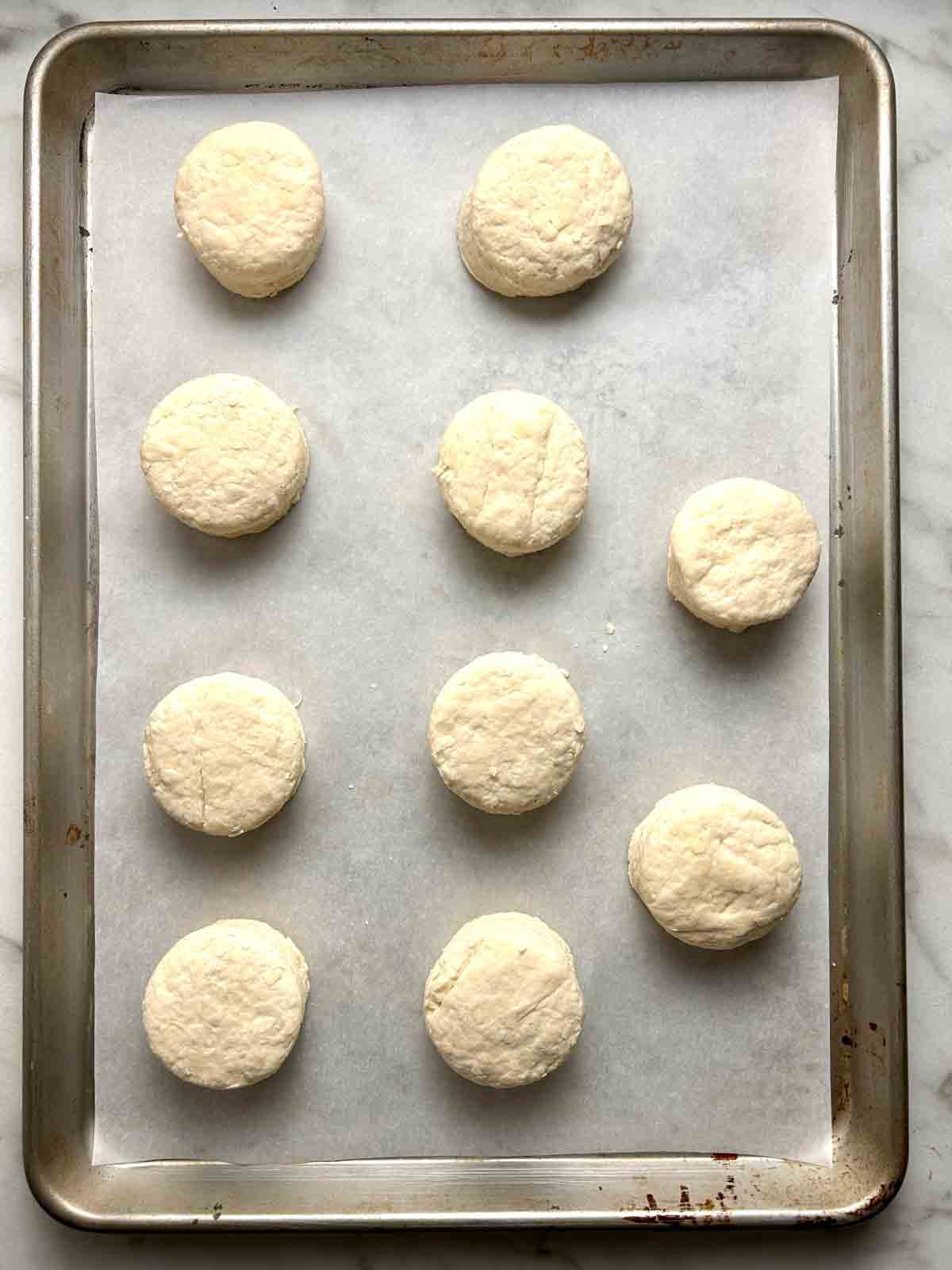 circles of dough arranged on baking sheet.