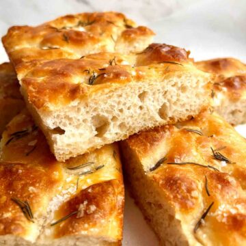 slice of focaccia with big air bubbles.