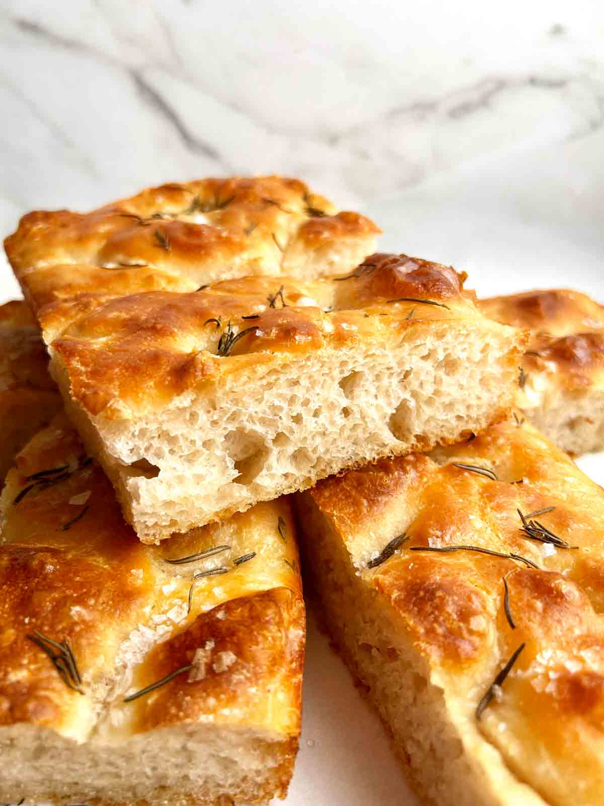 slice of focaccia with big air bubbles.