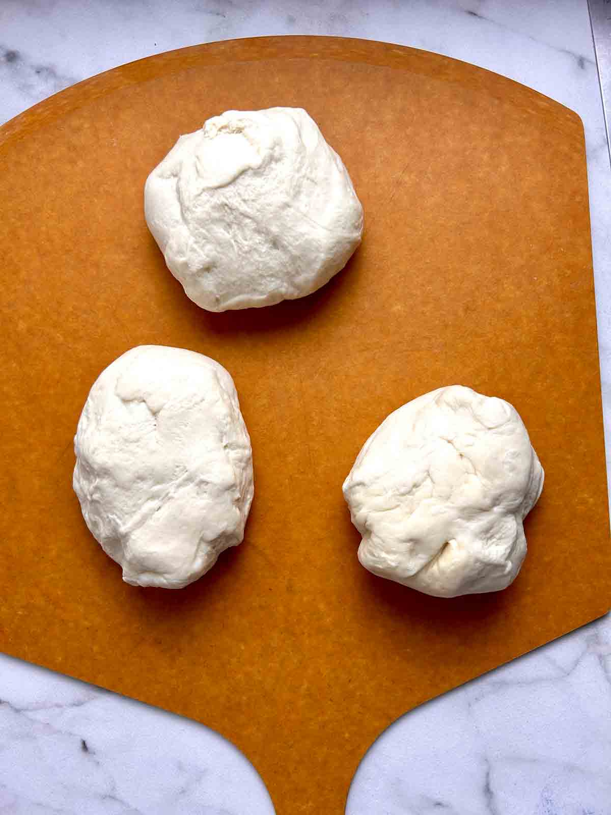 dough divided into 3 pieces.