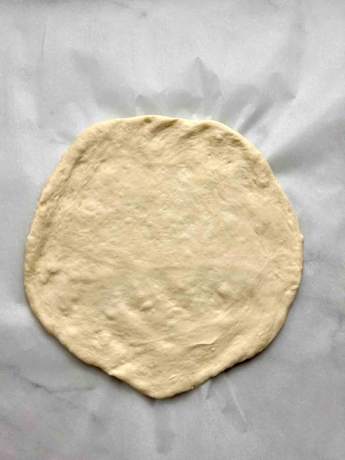 dough pressed into circle.
