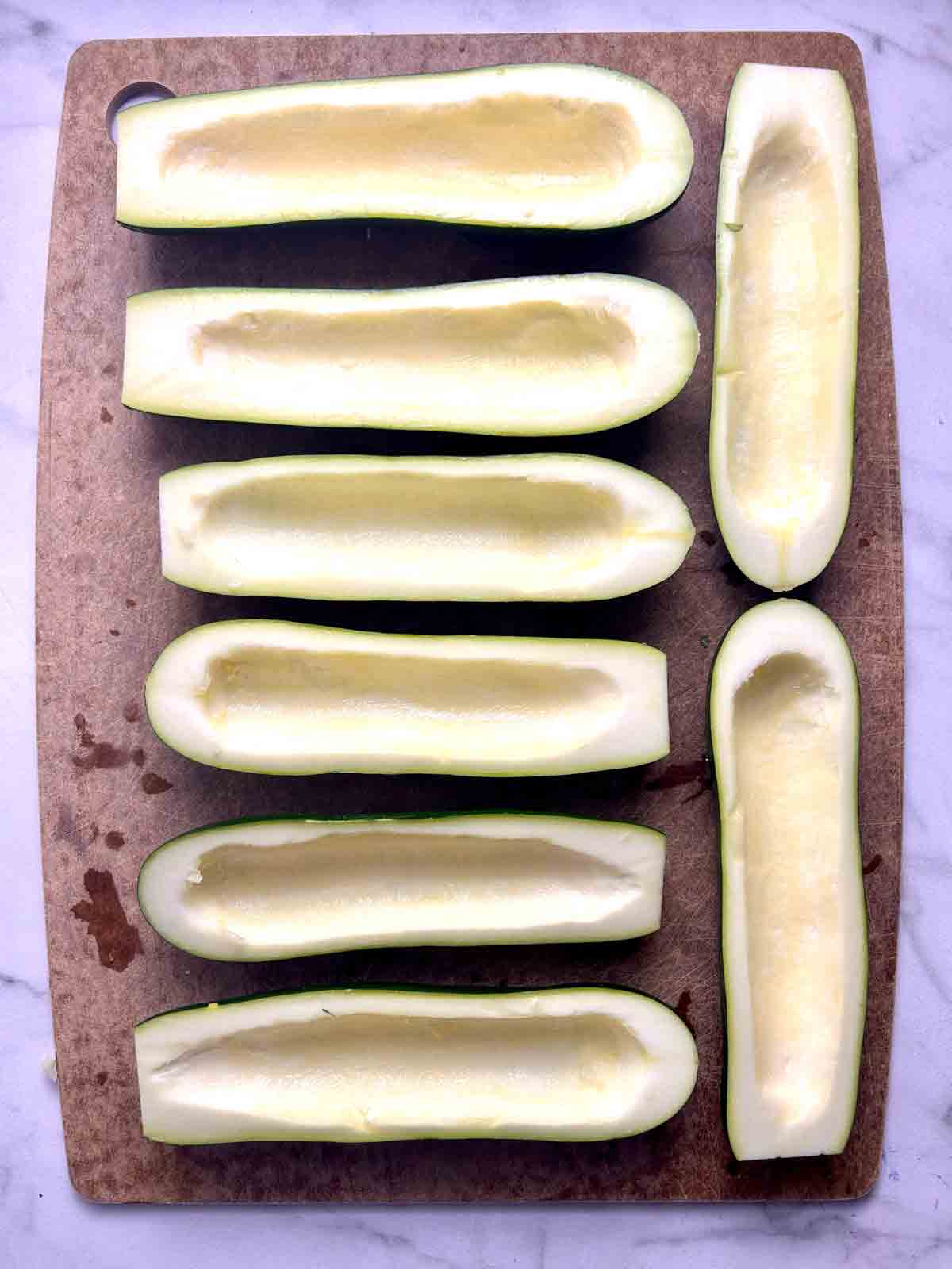 zucchini shells with centers scooped out.