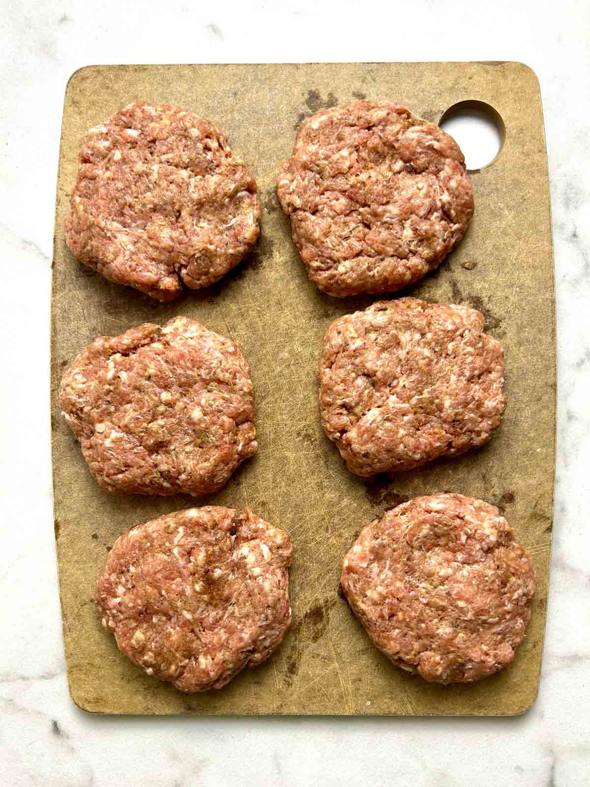 meat mixture divided into 6 portions.