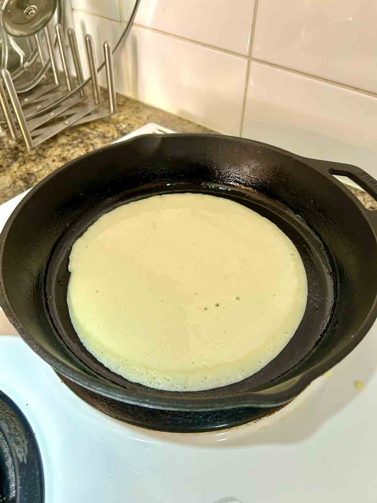 batter poured into pan and swirled into circle.