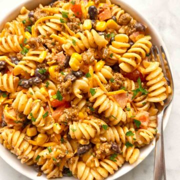 taco pasta salad in bowl with fork.