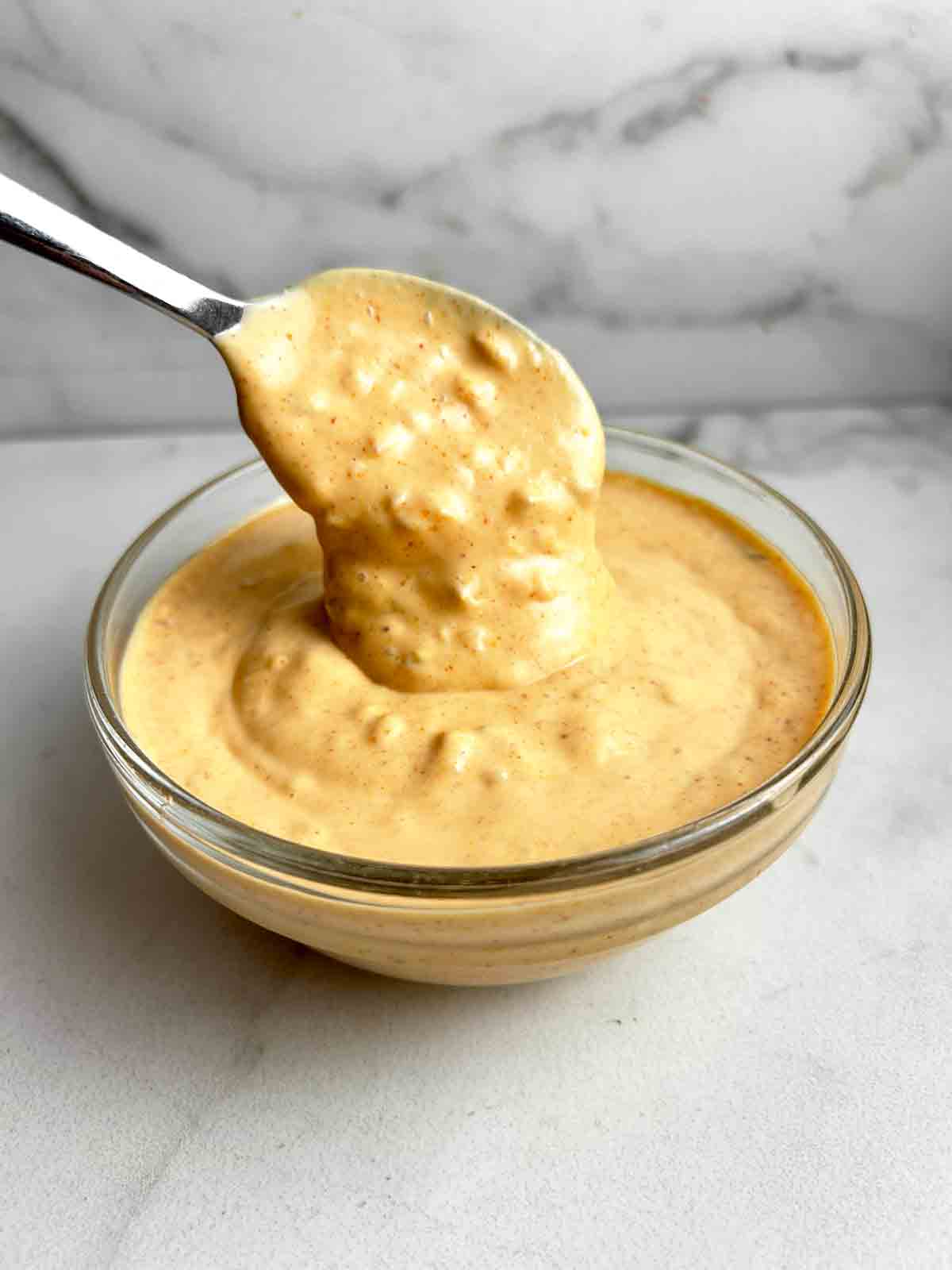 spoon lifting Big Mac Sauce from bowl.