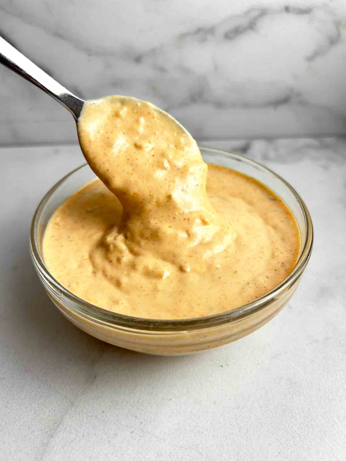 spoon lifting Big Mac Sauce from bowl.