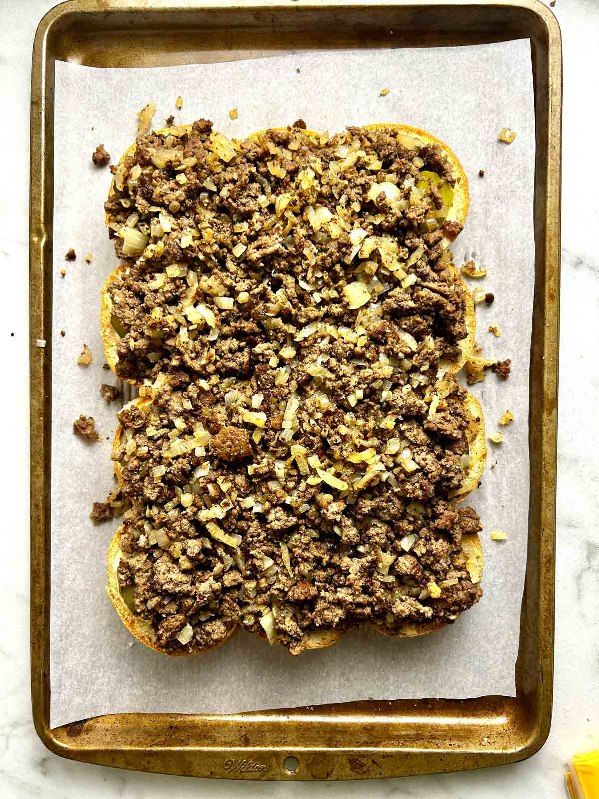 beef mixture piled on top of slider buns.