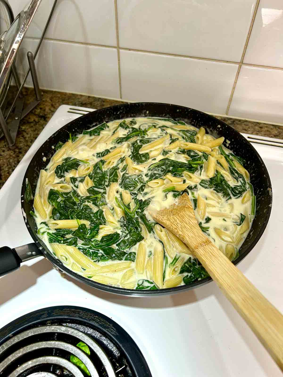 penne pasta added to cream sauce.