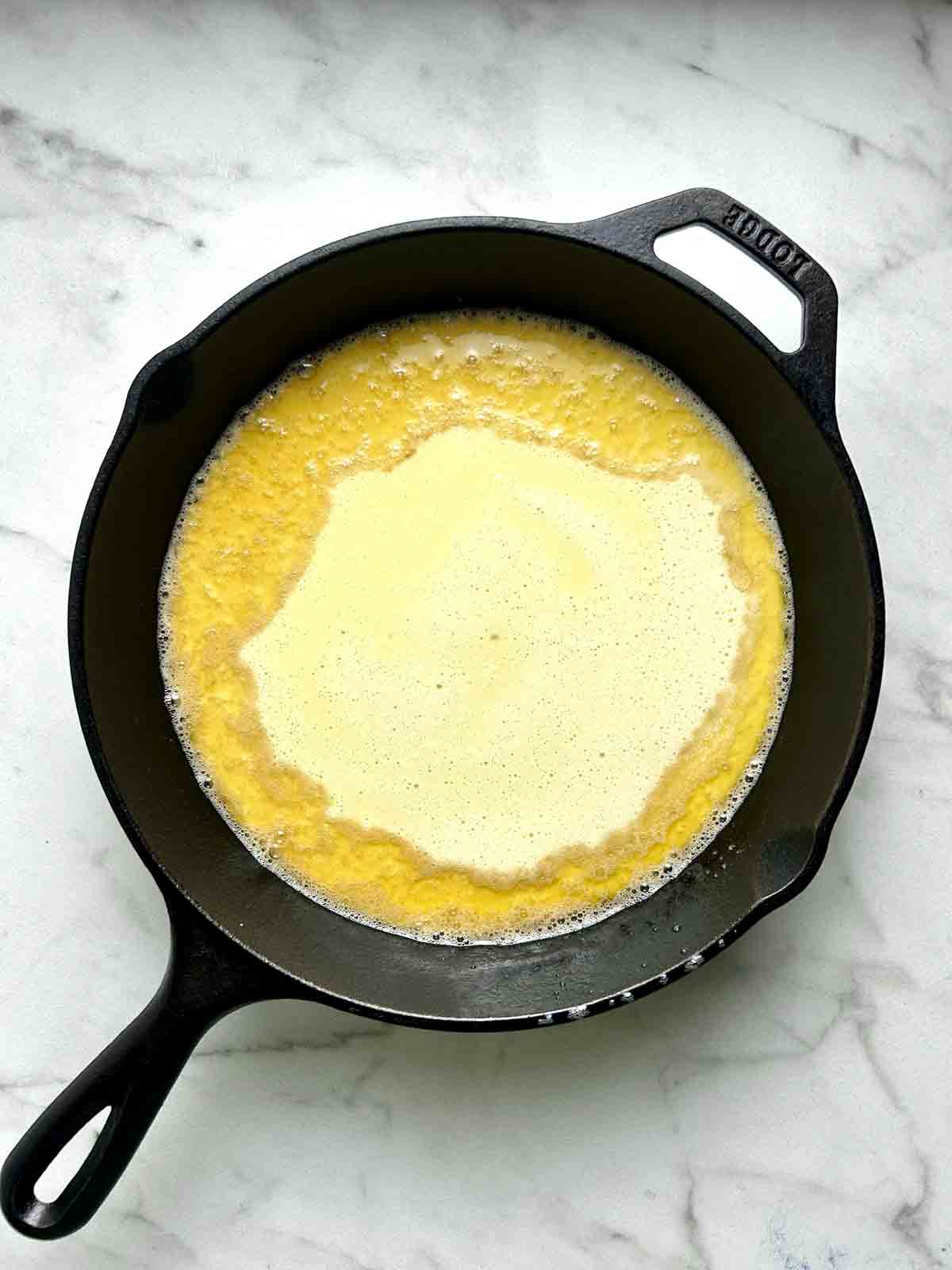 batter poured into hot cast iron skillet.