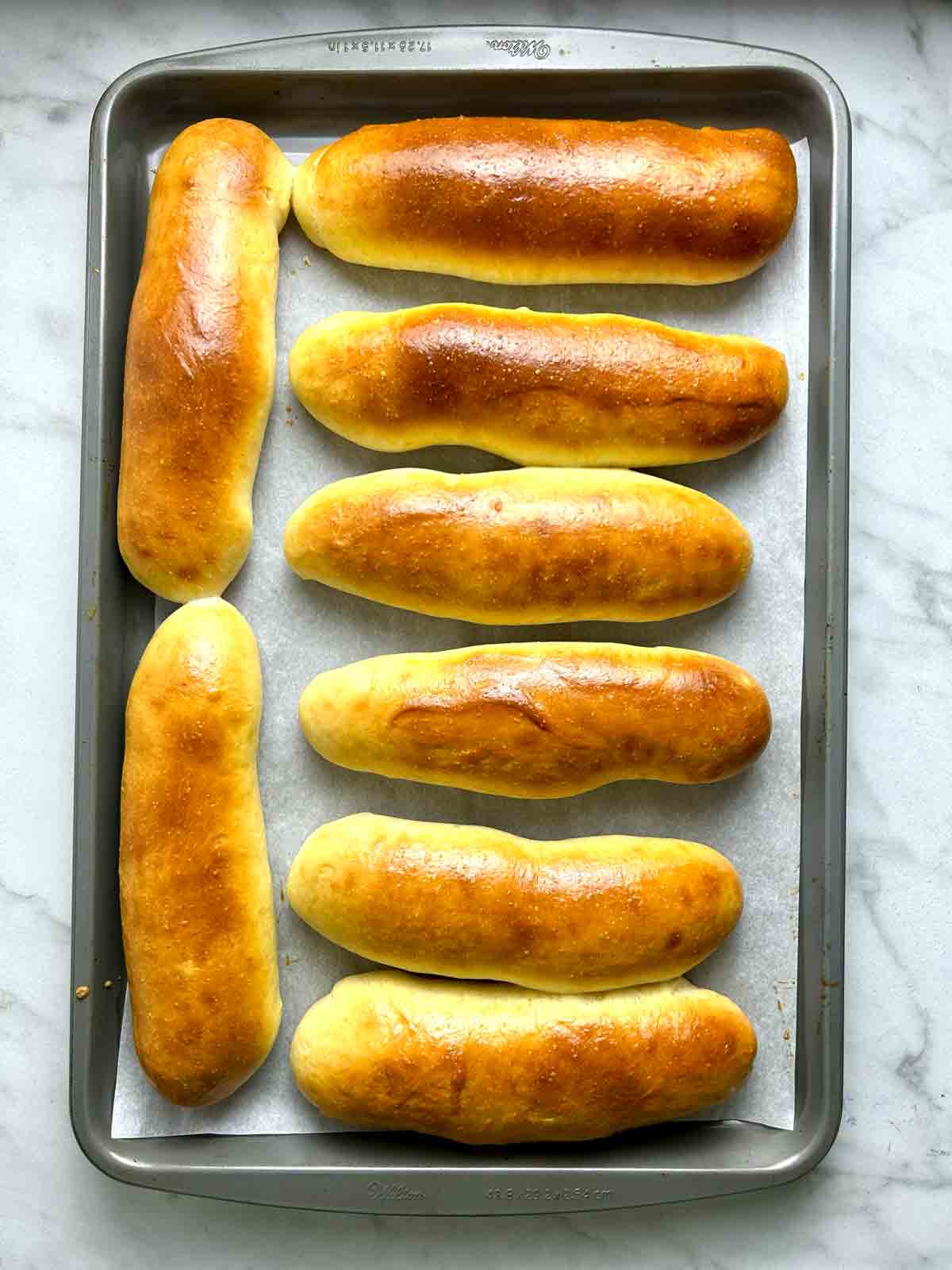 hot dog buns after baking; golden brown.