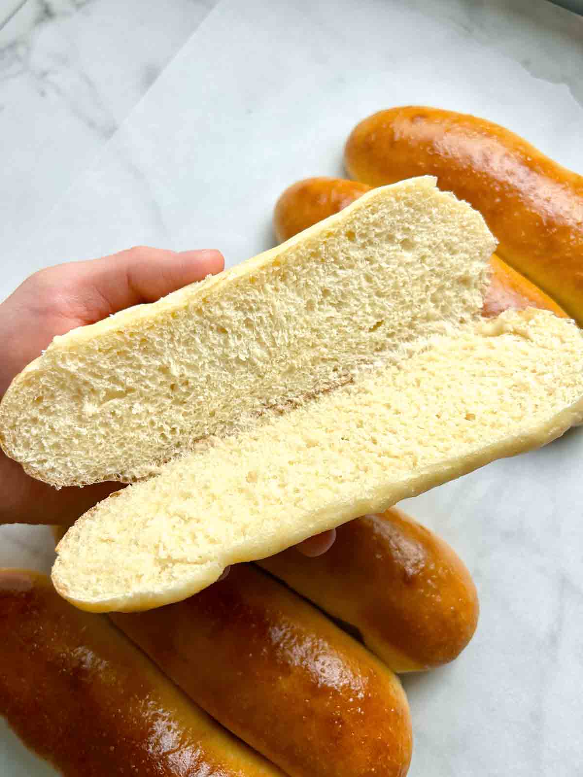 hot dog bun cut in half and opened to show the inside.