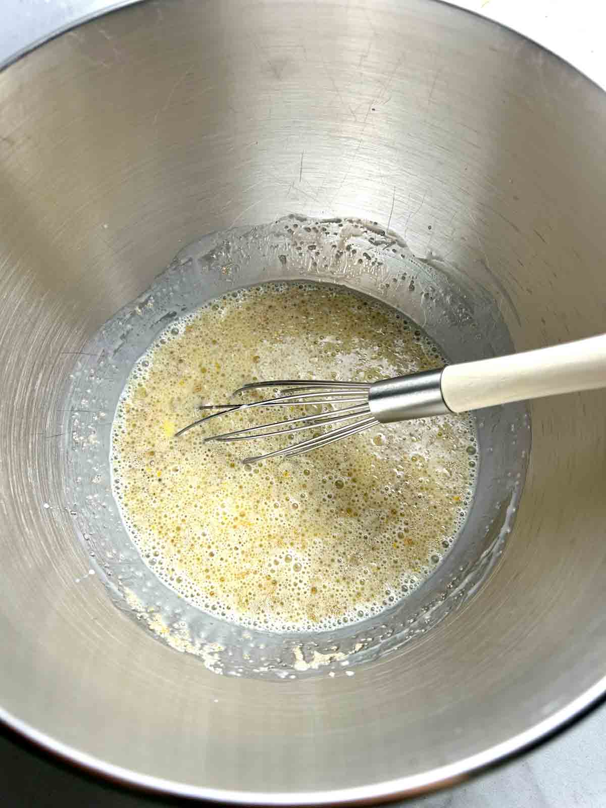 all ingredients except flour whisked in stand mixer bowl