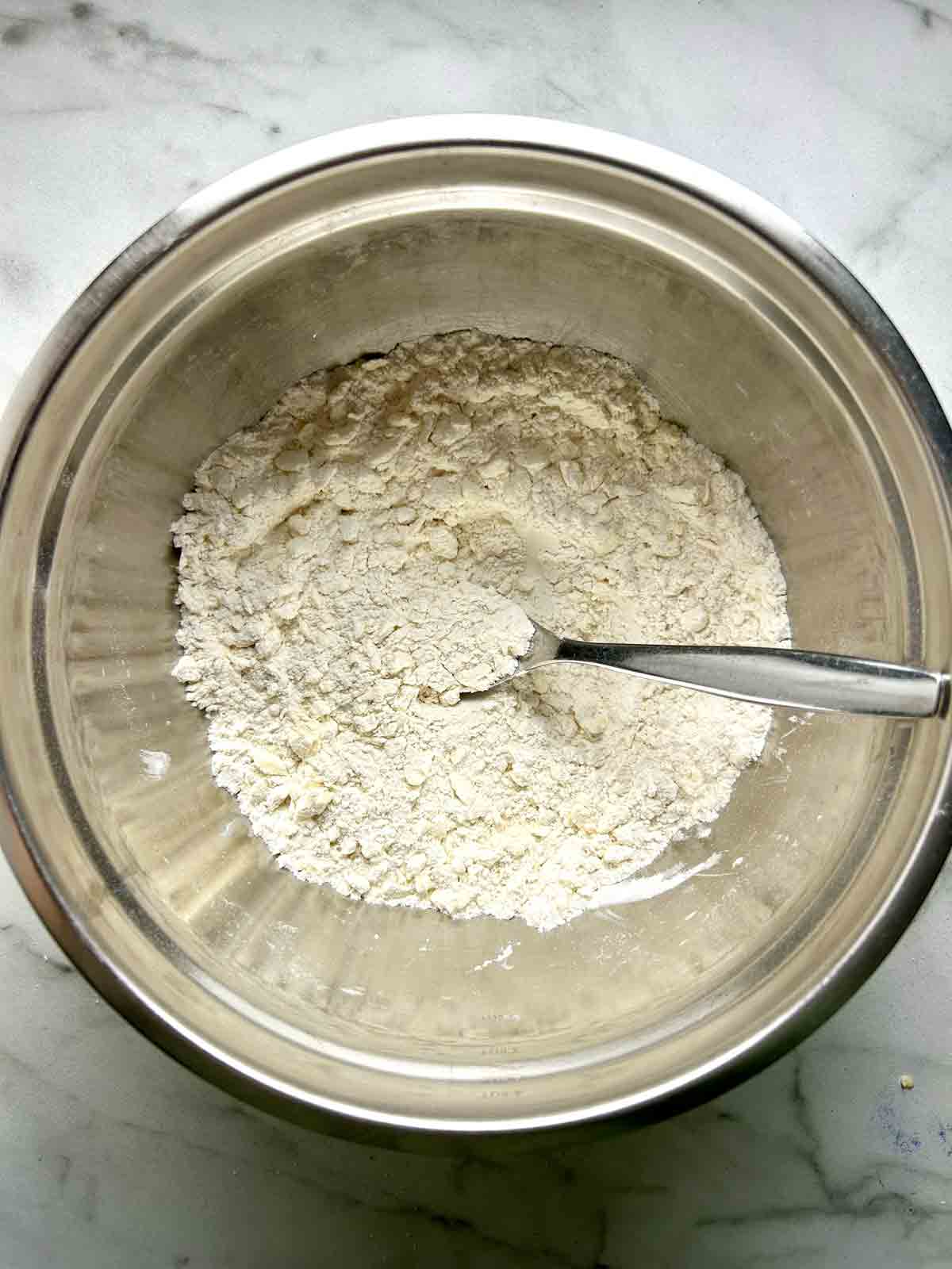 butter worked into flour mixture in bowl.