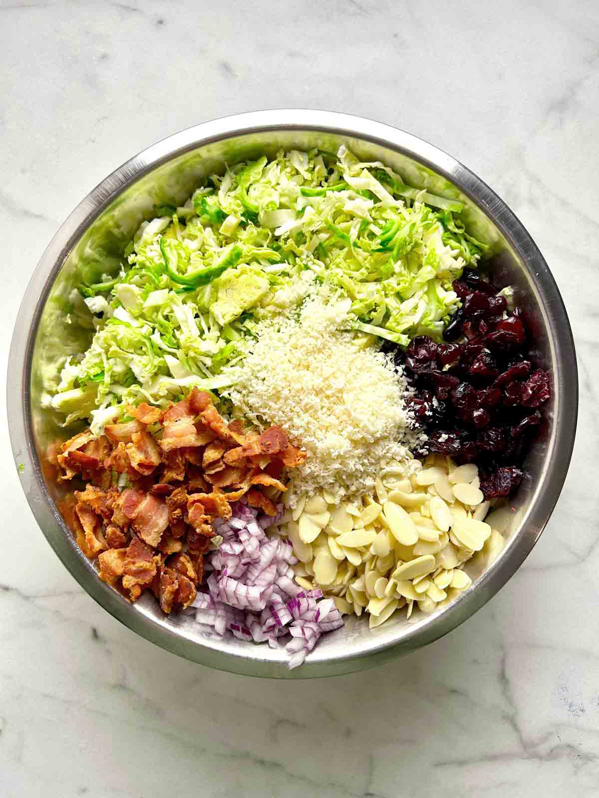 all salad components in bowl; unmixed.