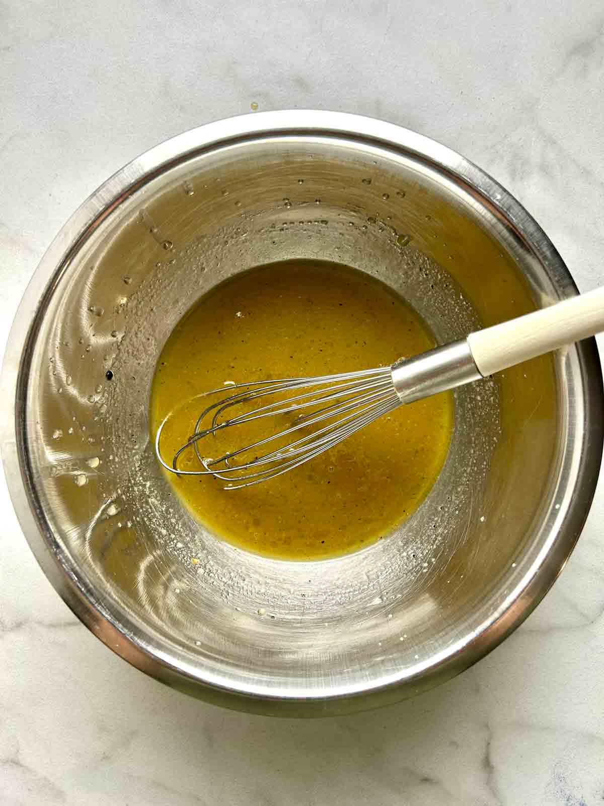 dressing whisked in bowl.