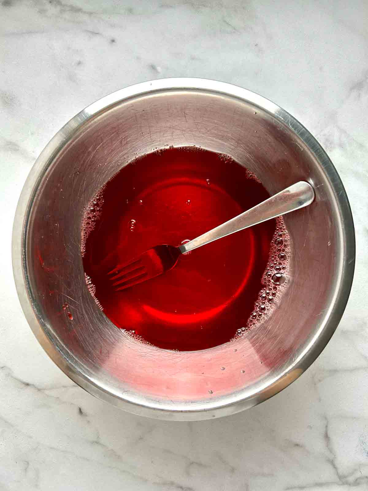 strawberry gelatin whisked with water.