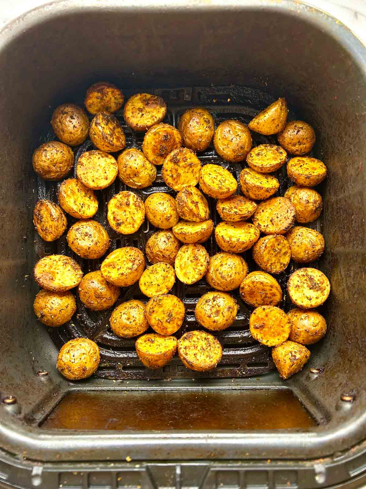 potatoes after air frying; golden and crispy on outside.