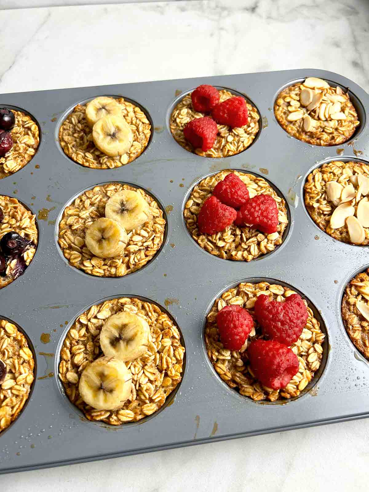close up of baked oatmeal cups still in muffin pan.