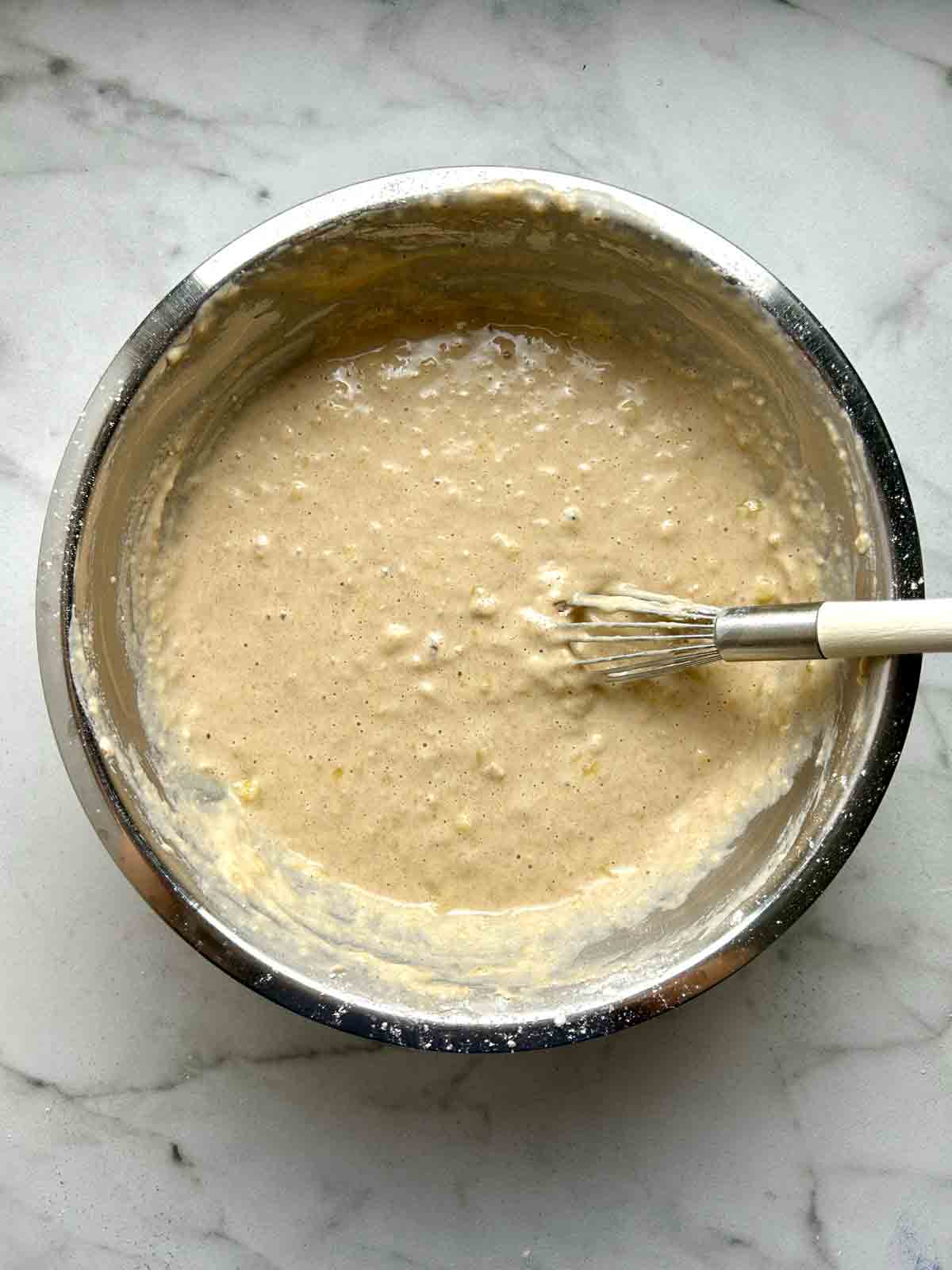 batter whisked together in bowl; noticeably chunky.
