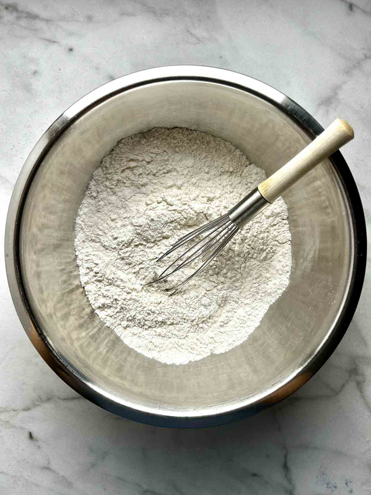 dry ingredients whisked in metal bowl.