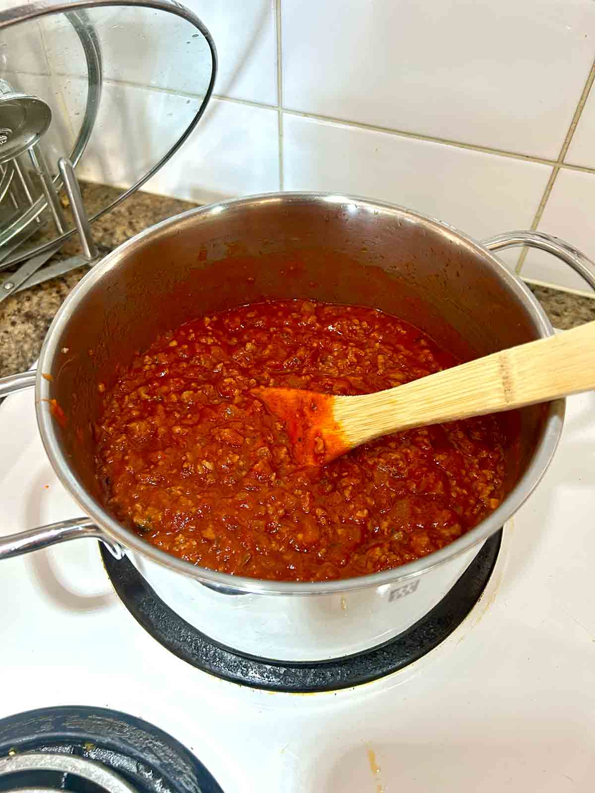 meat sauce cooking in pot.