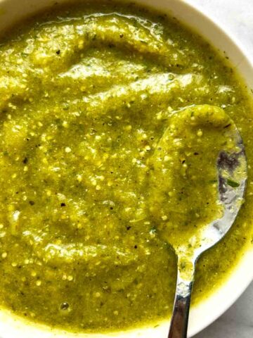 close up of salsa verde in white bowl.