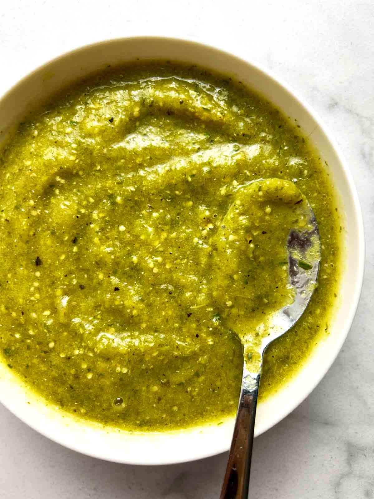 close up of salsa verde in white bowl.