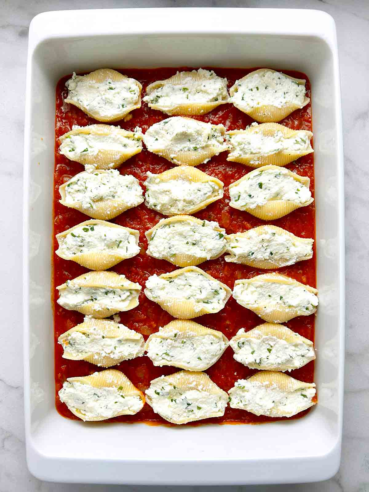 shells stuffed with ricotta mixture and placed in baking dish.