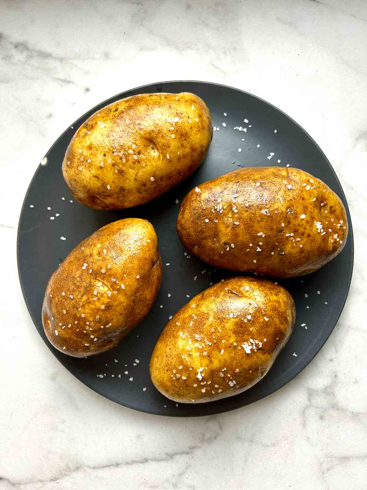 salt and oil rubbed over potatoes.