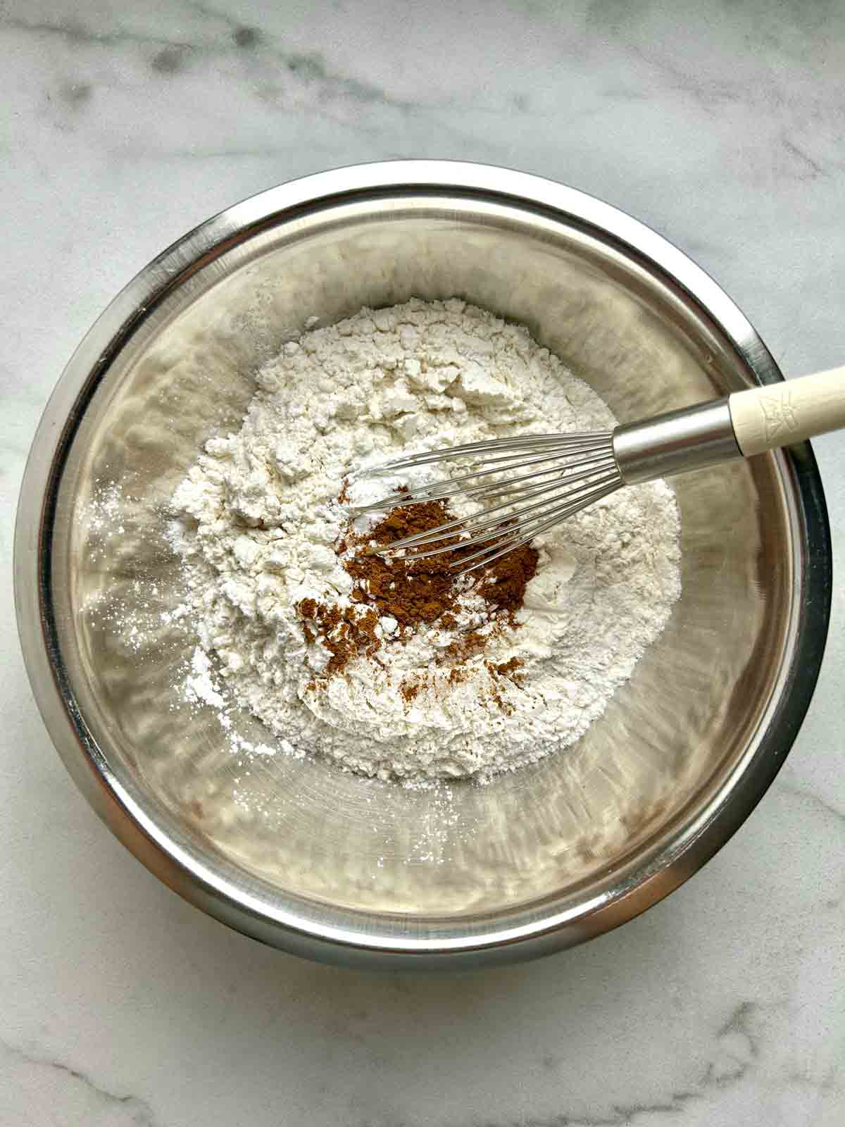 dry ingredients in metal bowl with whisk.