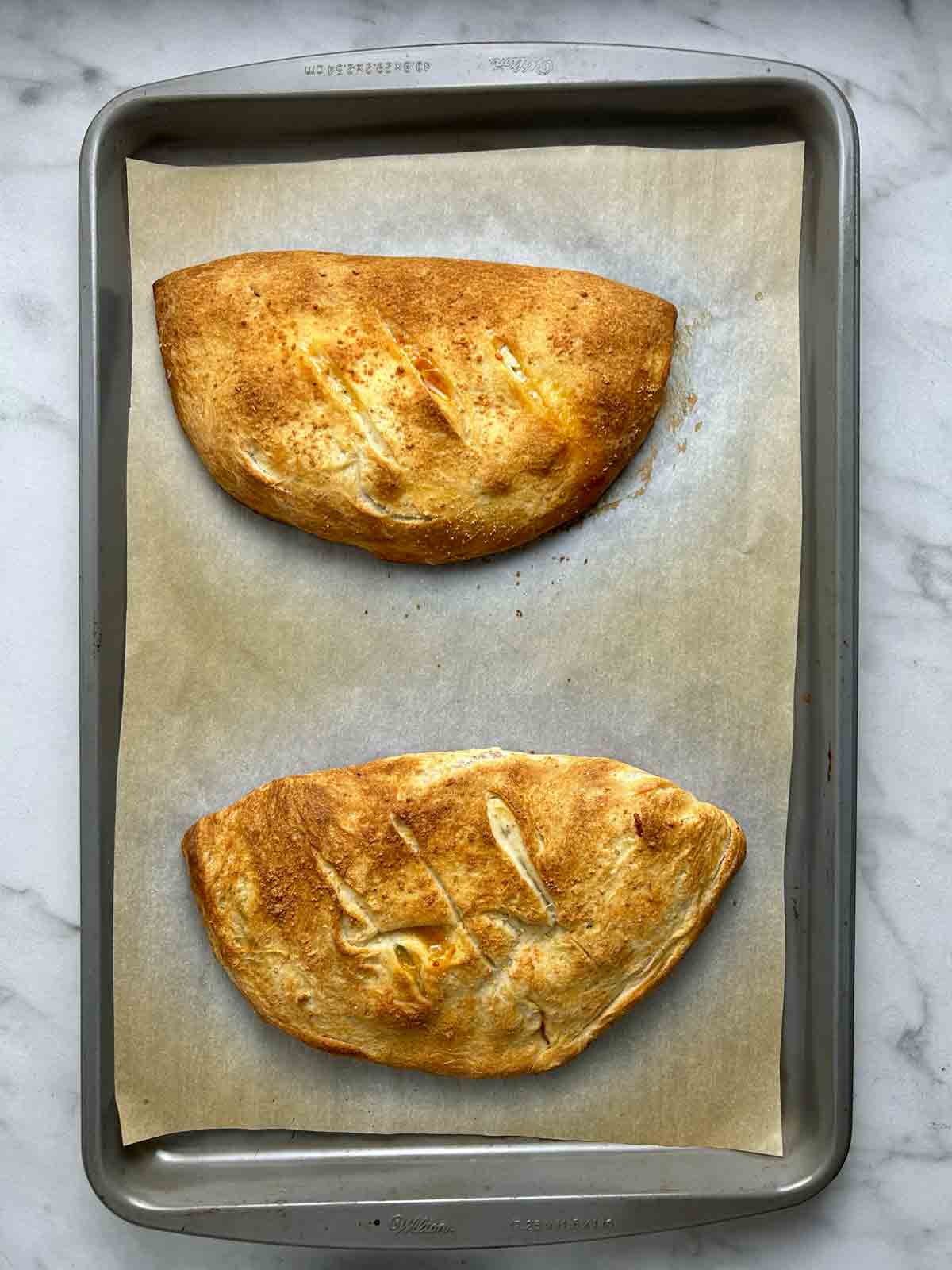 calzones after baking; golden brown.