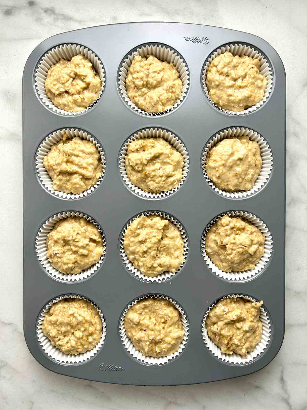 batter scooped into muffin pan.