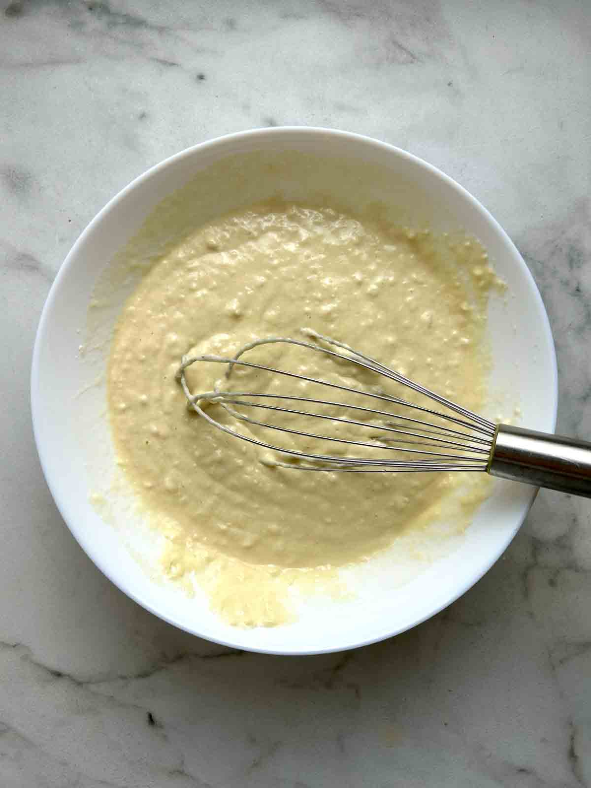 batter whisked in white bowl.