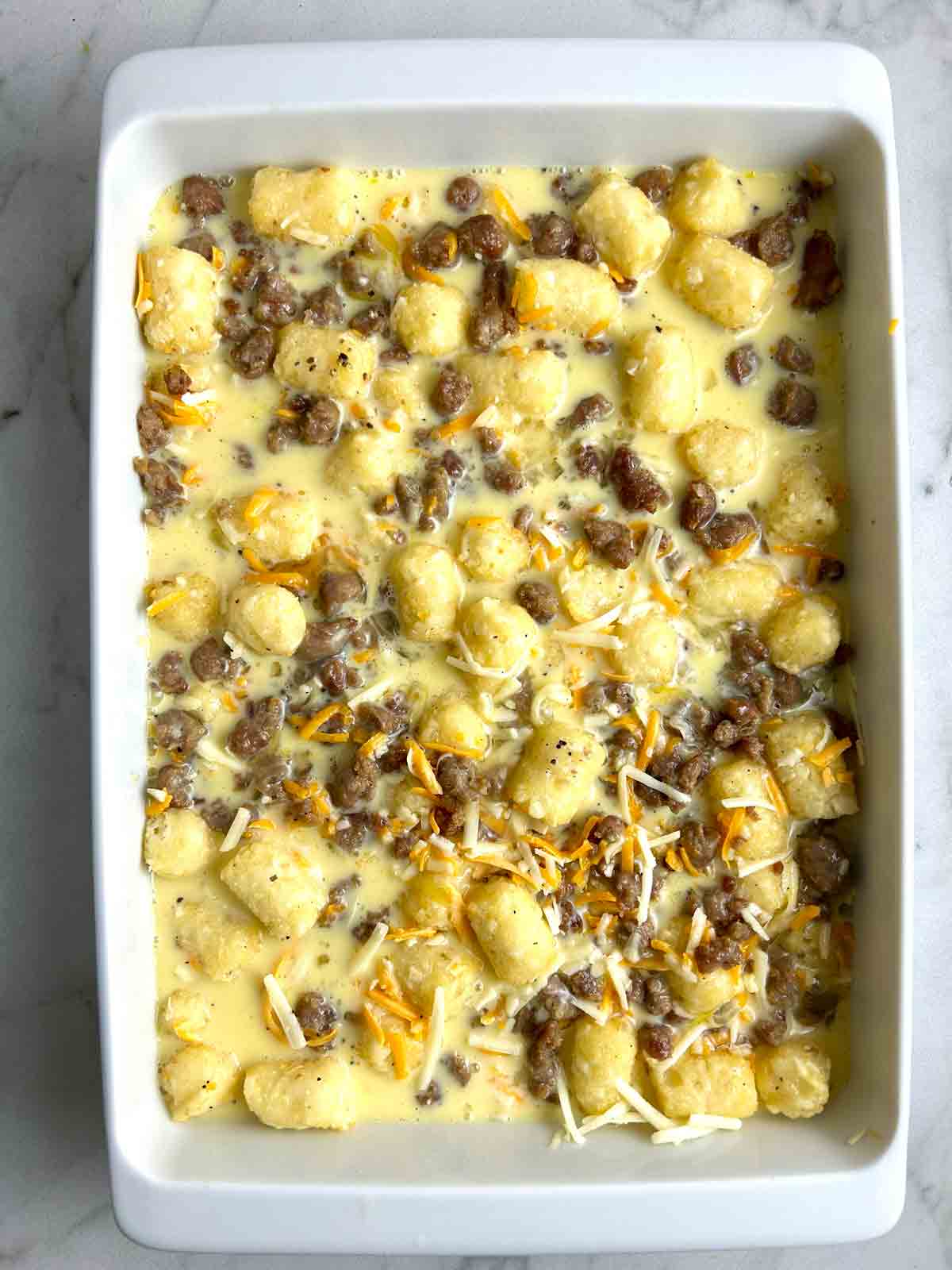 milk and egg mixture poured into casserole dish.