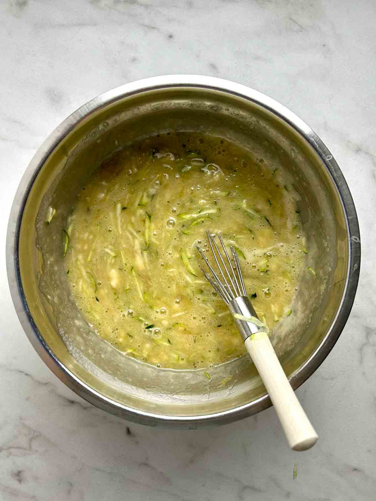 wet mixture whisked in bowl.