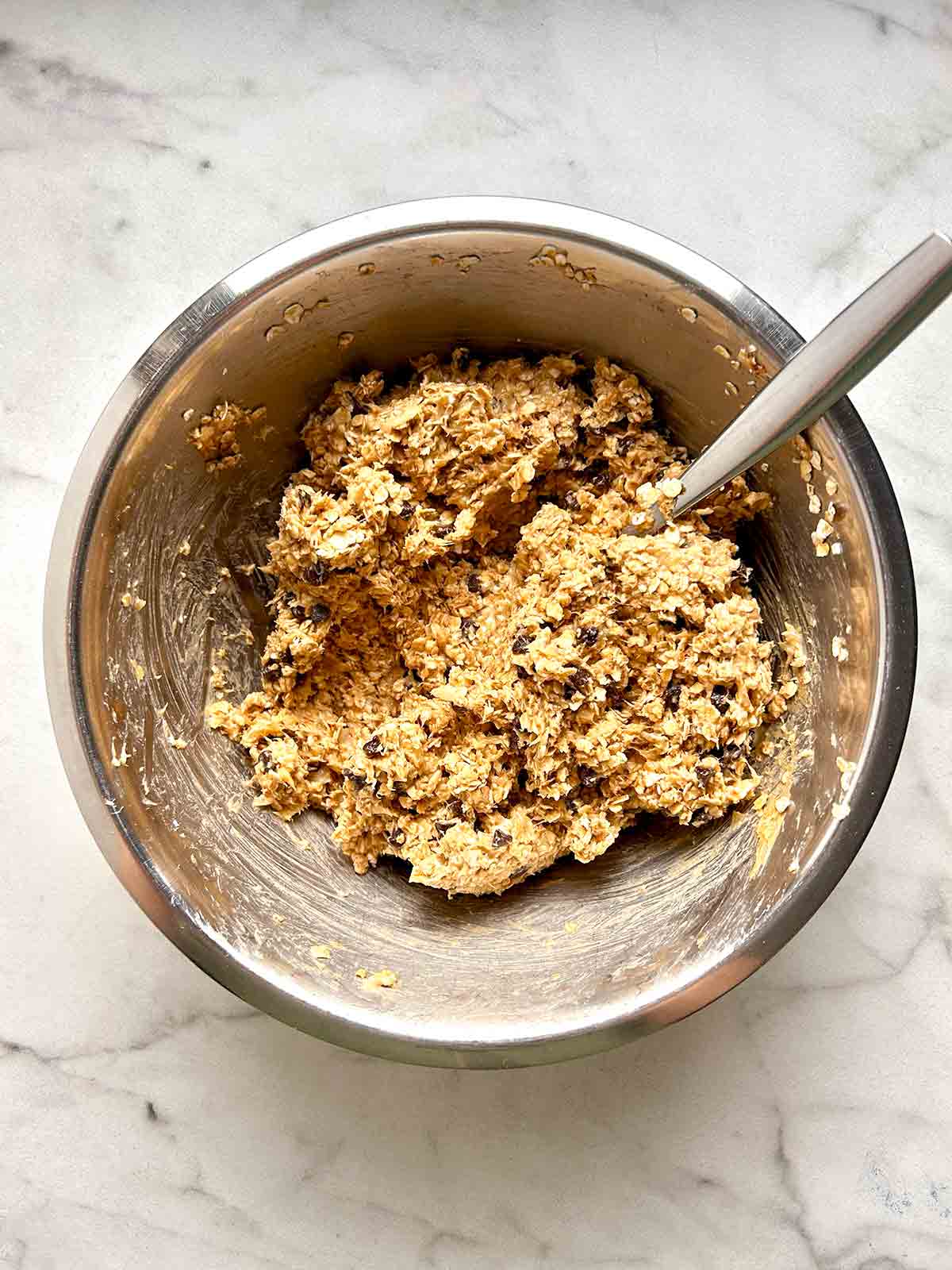 all ingredients mixed together in large metal bowl.