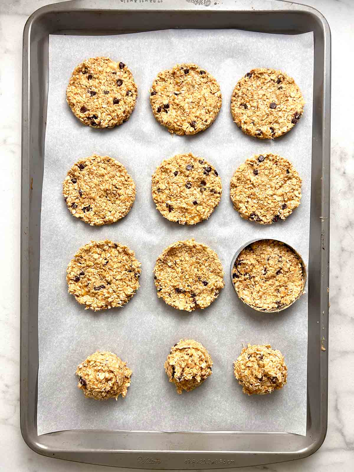 dough balls pressed into circles with cookie cutter.