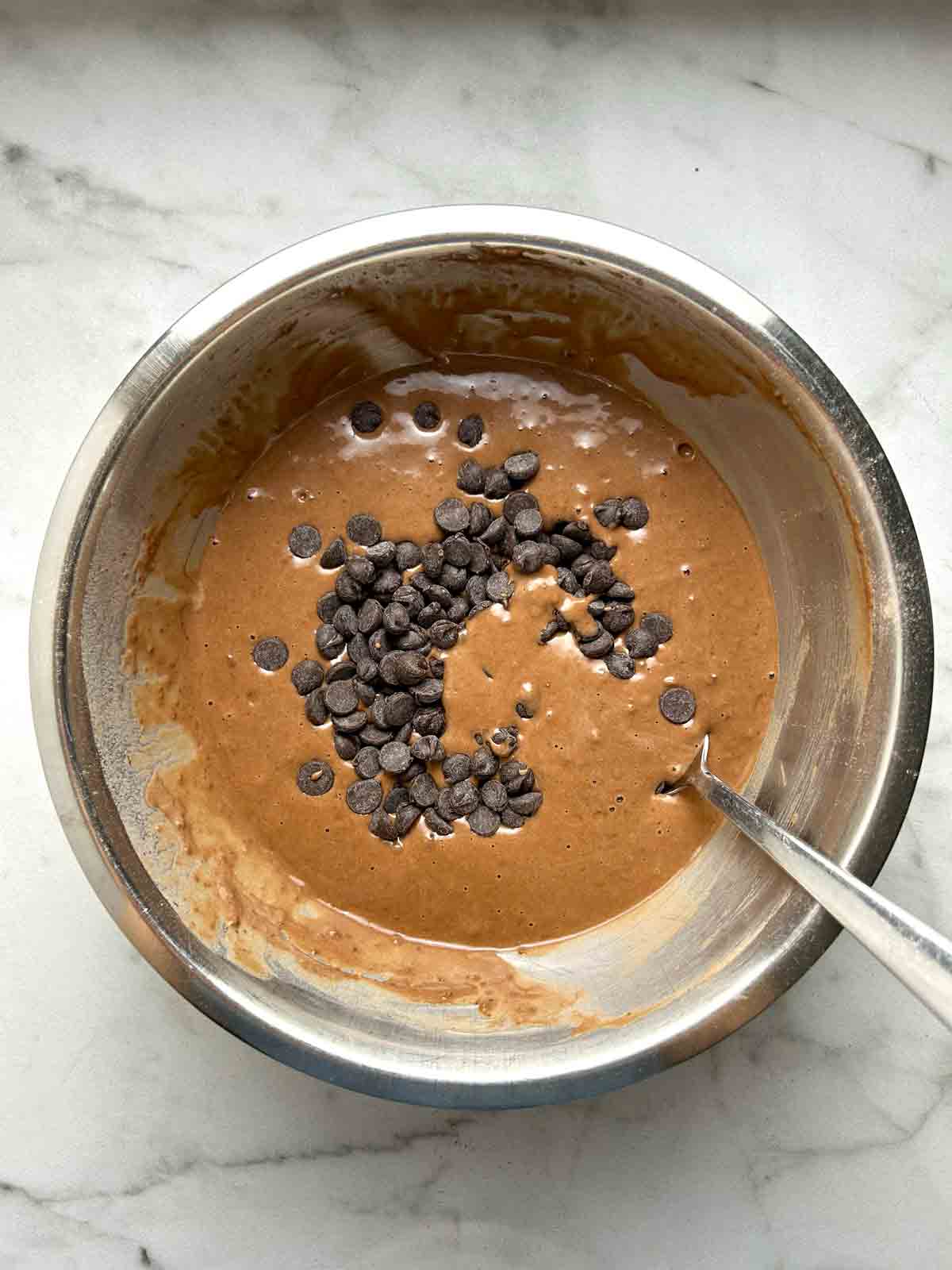 chocolate chips added to bowl of batter.