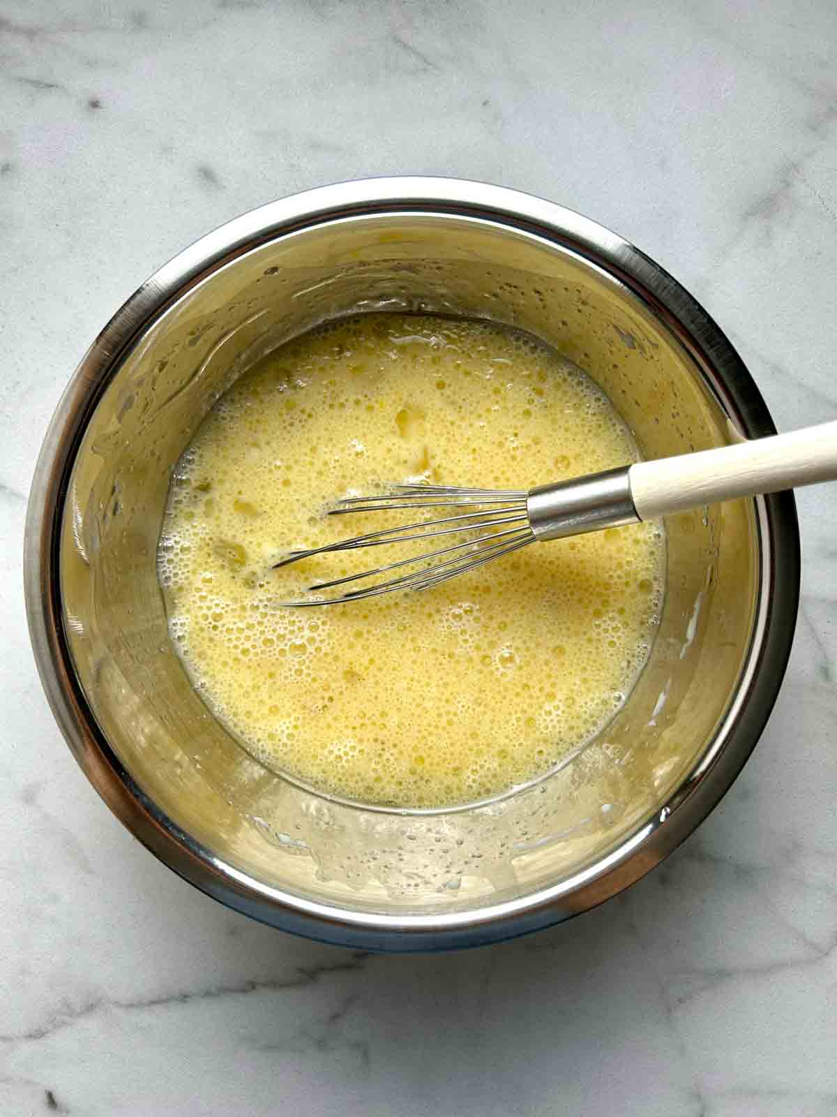 wet ingredients whisked in bowl.
