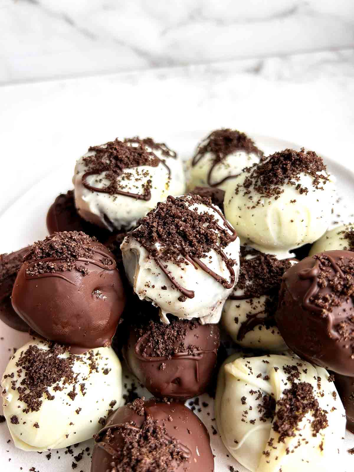 Oreo balls stacked on plate.